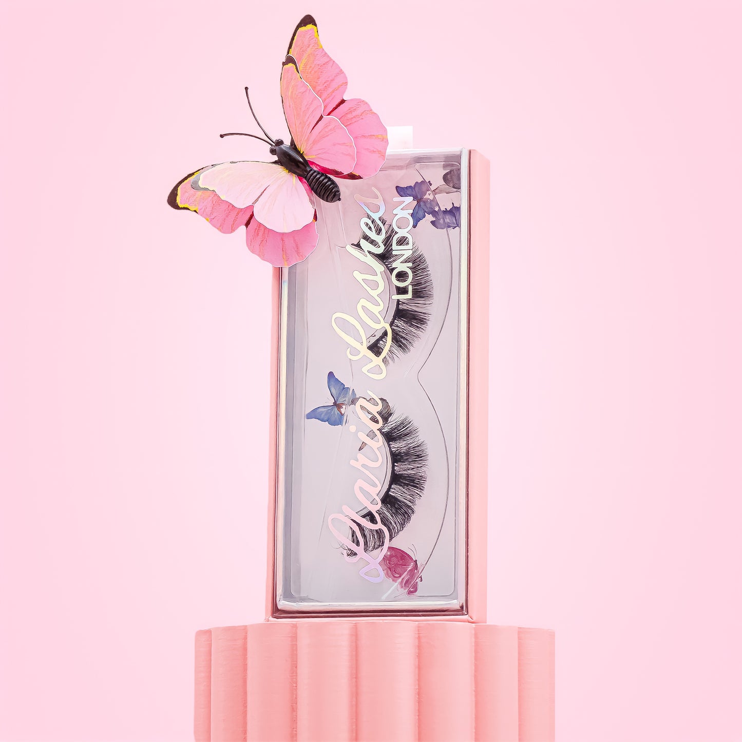 Long wispy russian strip false eyelashes in lash box with butterfly.