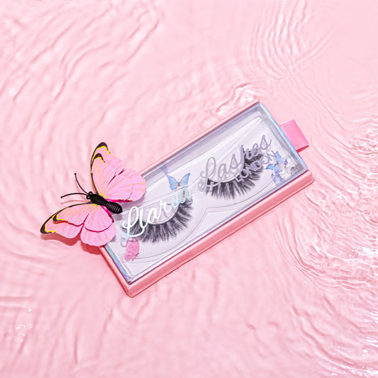 long russian style strip false eyelashes in lash box in pink water with butterflies
