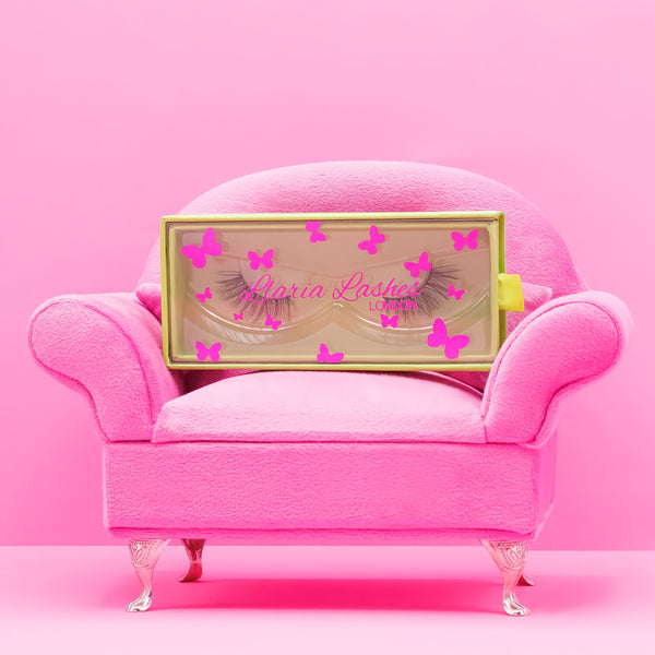 cat eye corner half lash faux mink false eyelashes on pink sofa couch.